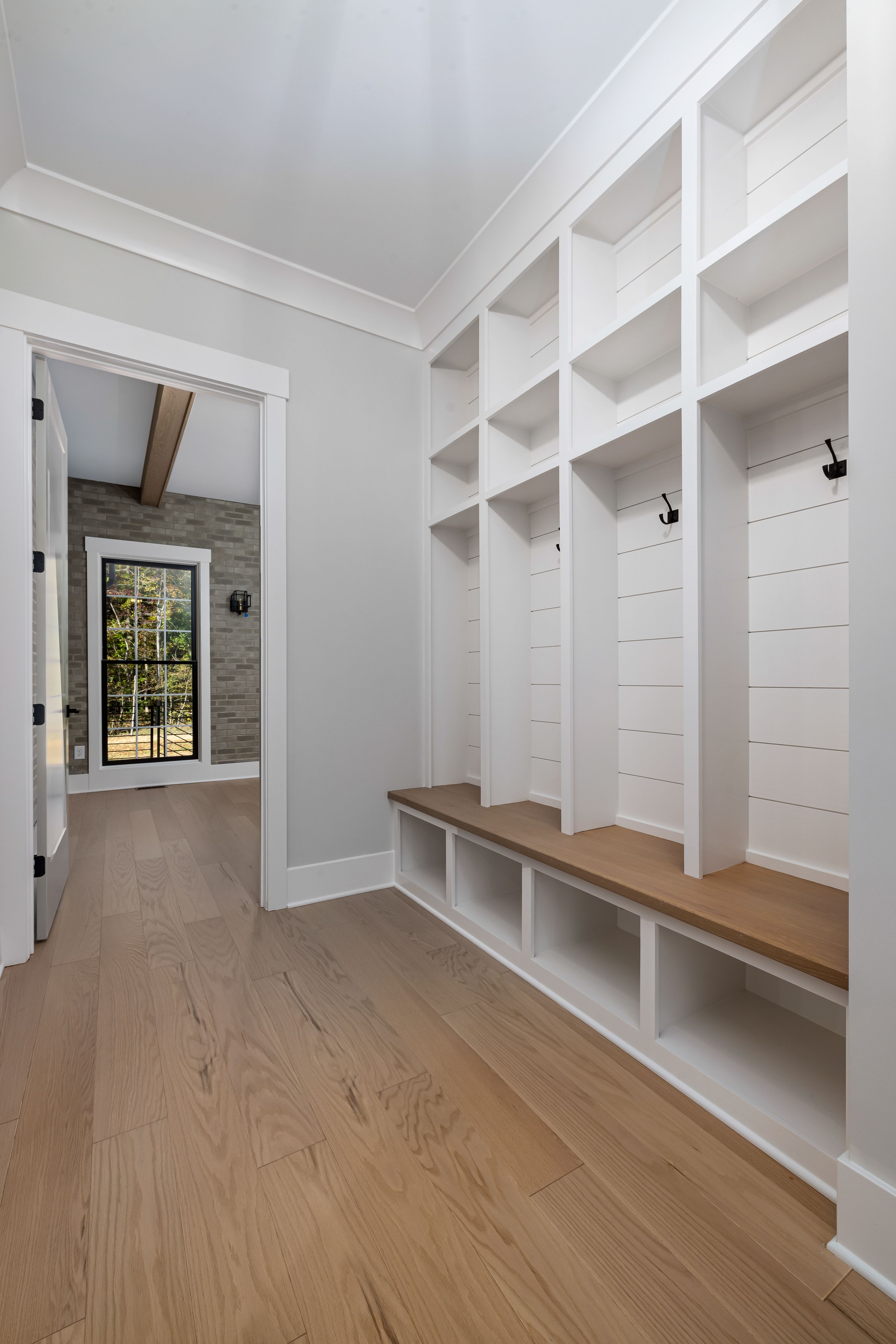 White mudroom with built-in shelves